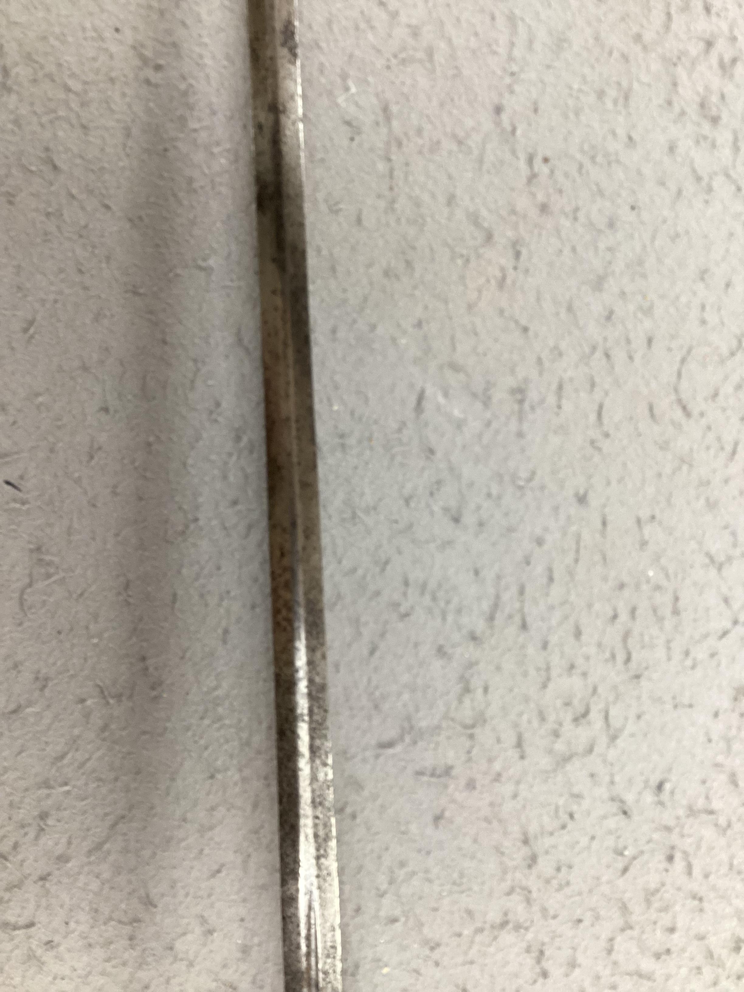 A swept hilt rapier, c.1620, blade fullered at the forte, iron guard of conventional form with later pommel and wooden grip, blade 113cm